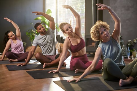 Group stretching on yoga mats
